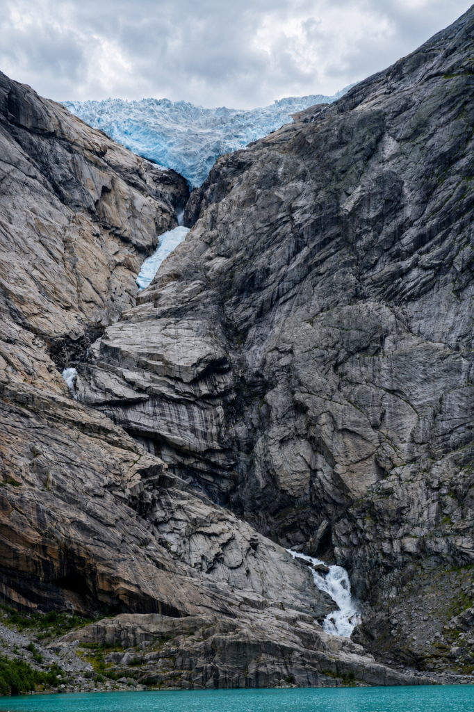 Briksdal Glacier above its glacial lake in Olden, Norway